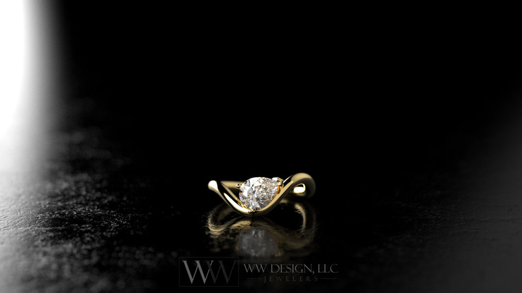 Gold ring with a diamond on a black background